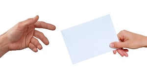 Against a stark white background, a hand holding a white envelope on the right is passing the envelope to a waiting hand on the left, with fingers outstretched, posing the question, How do  my creditors get notice when I file bankruptcy in MN? 