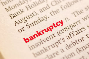 Closeup of a the word "bankruptcy" in bold red on a dictionary page, representing Minnesota Chapter 13 bankruptcy explained in simple terms.