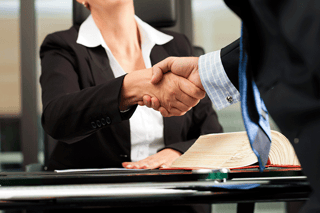 client-shaking-hand-with-our-eagan-bankruptcy-lawyers.png