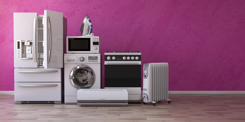 Various white household appliances on a light wood parquet floor, in front of a bubblegum pink wall with a white baseboard, representing the need for understanding Minnesota law to protect your property.